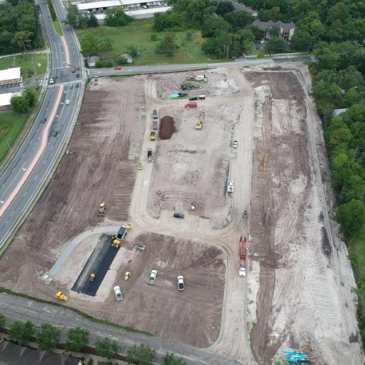 Aerial view of a parking lot which asphalt paving is needed.