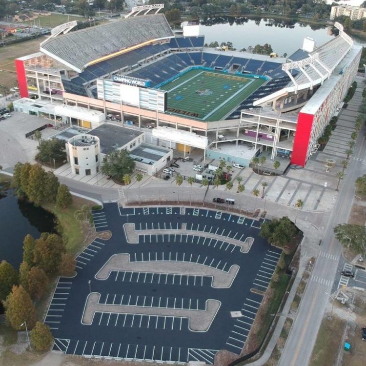 A parking lot looking professional and clean because of asphalt paving.